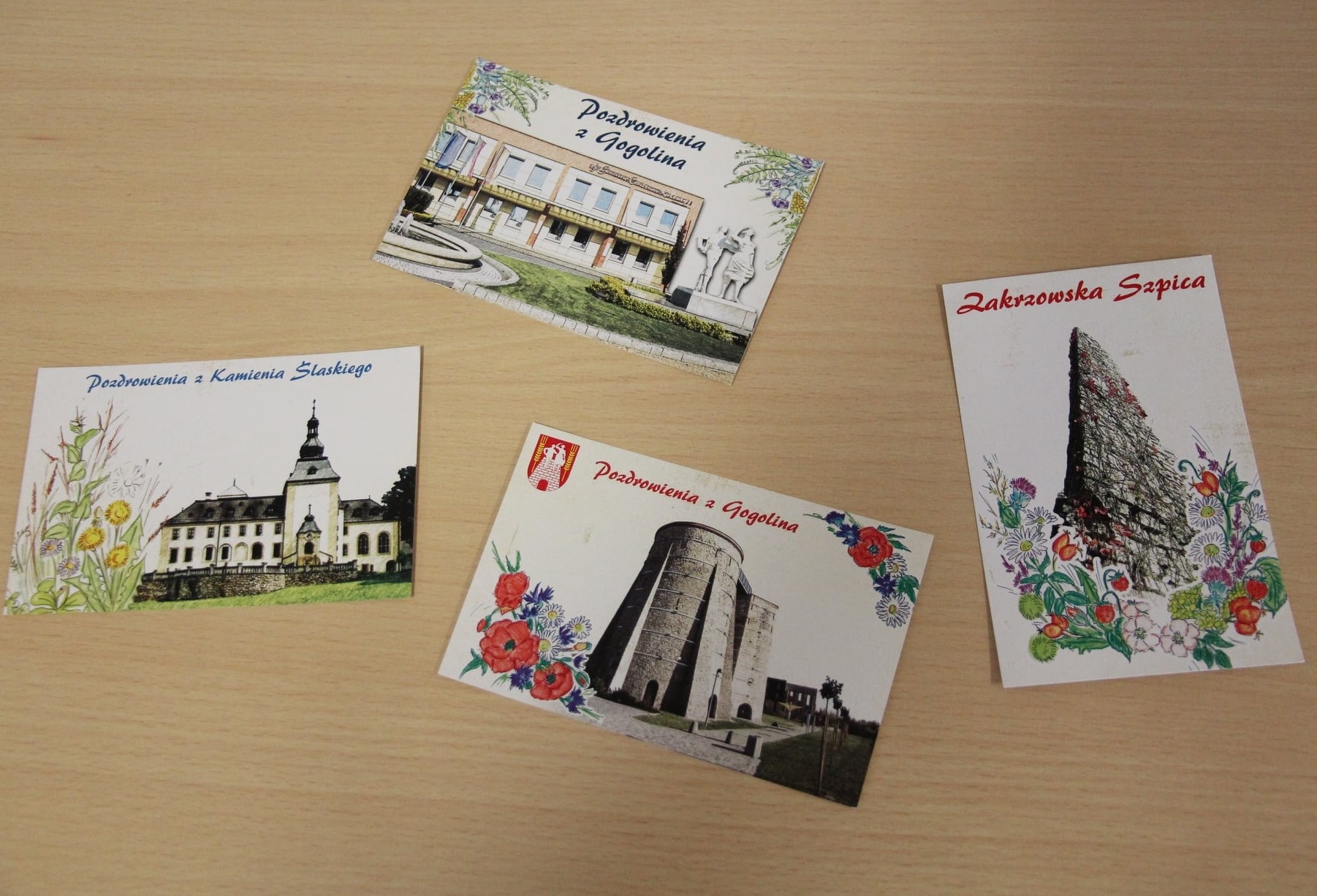 pocztówki przedstawiające atrakcje naszej gminy, z motywem regionalnych ziół i kwiatów oraz z ich nazwami w gwarze śląskiej